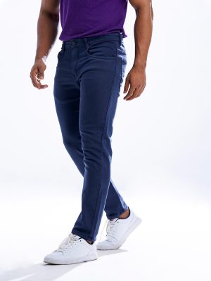 Men's slim fitted jeans in cotton spandex denim fabric. Five pockets, button fastening on the front and zipper fly.